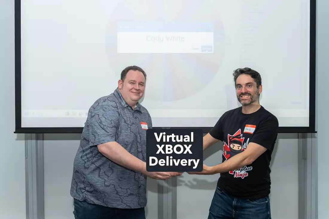 Cody White receiving the Xbox draw prize at Workplace Ninjas Toronto 2025